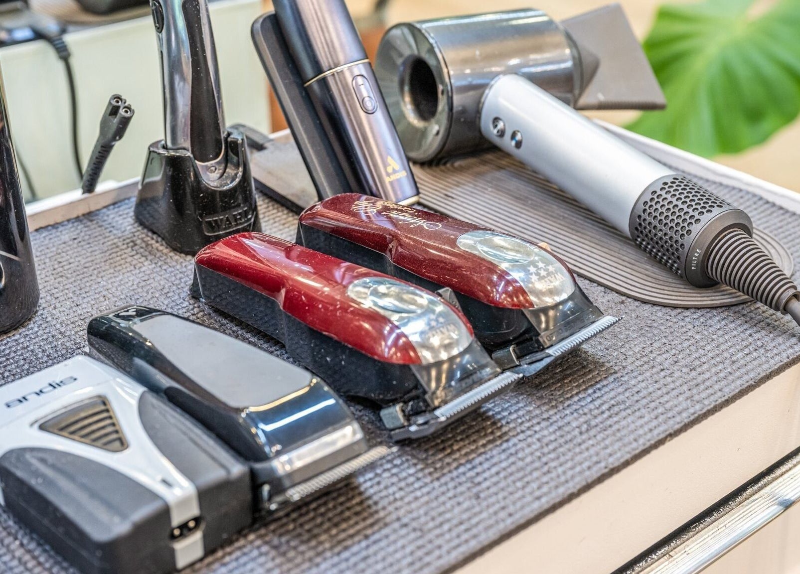 Professional grooming tools at IV Barbers, Melbourne, Victoria, AU, showcasing clippers and dryers.