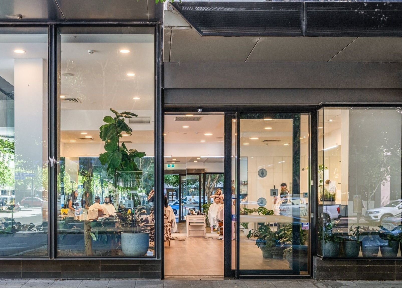 IV Barbers' stylish front view in Melbourne, Victoria, AU with a modern glass entrance.