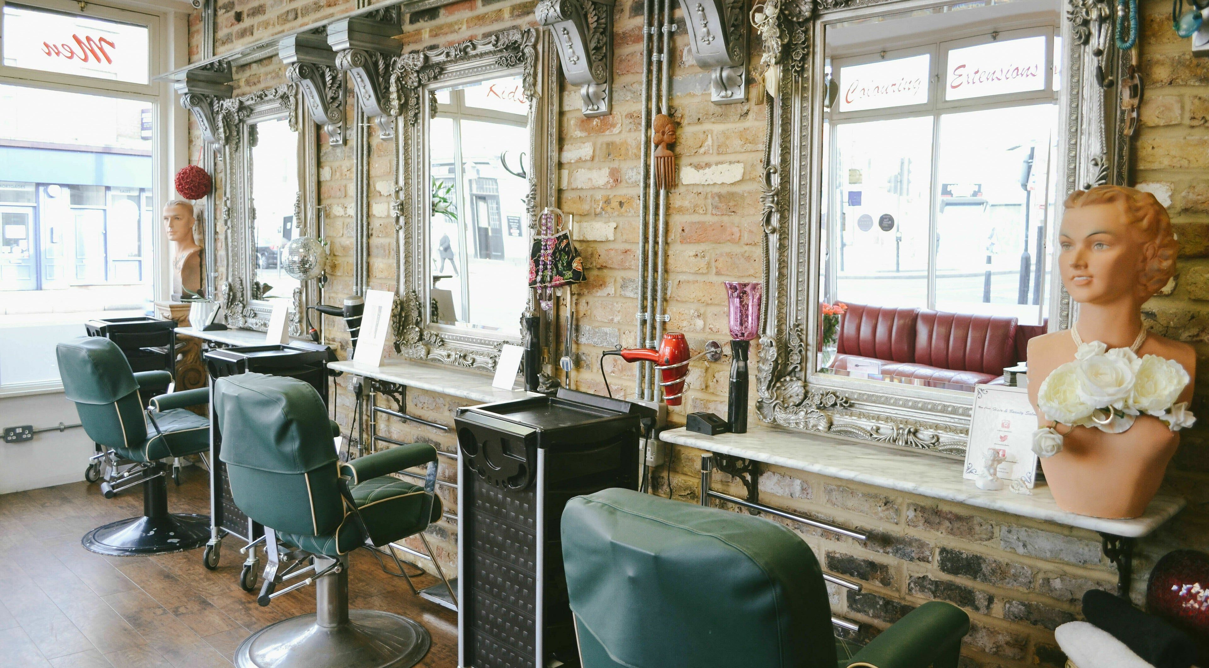 Elegant salon chairs and ornate mirrors at New Cross Hair and Beauty Salon, London, England, GB.