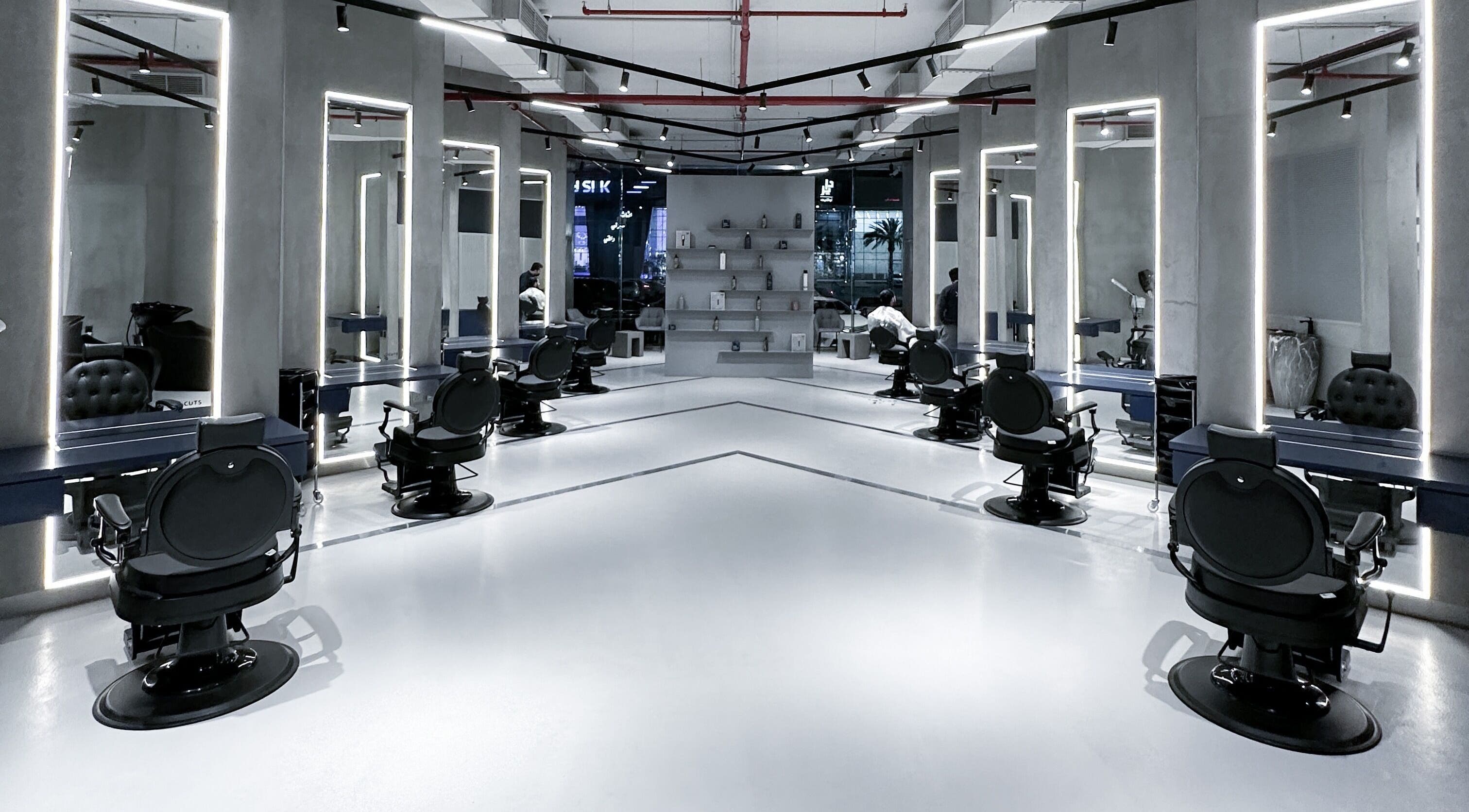 9CUTS Barber Shop interior with sleek black chairs in Riyadh I الرياض, SA.