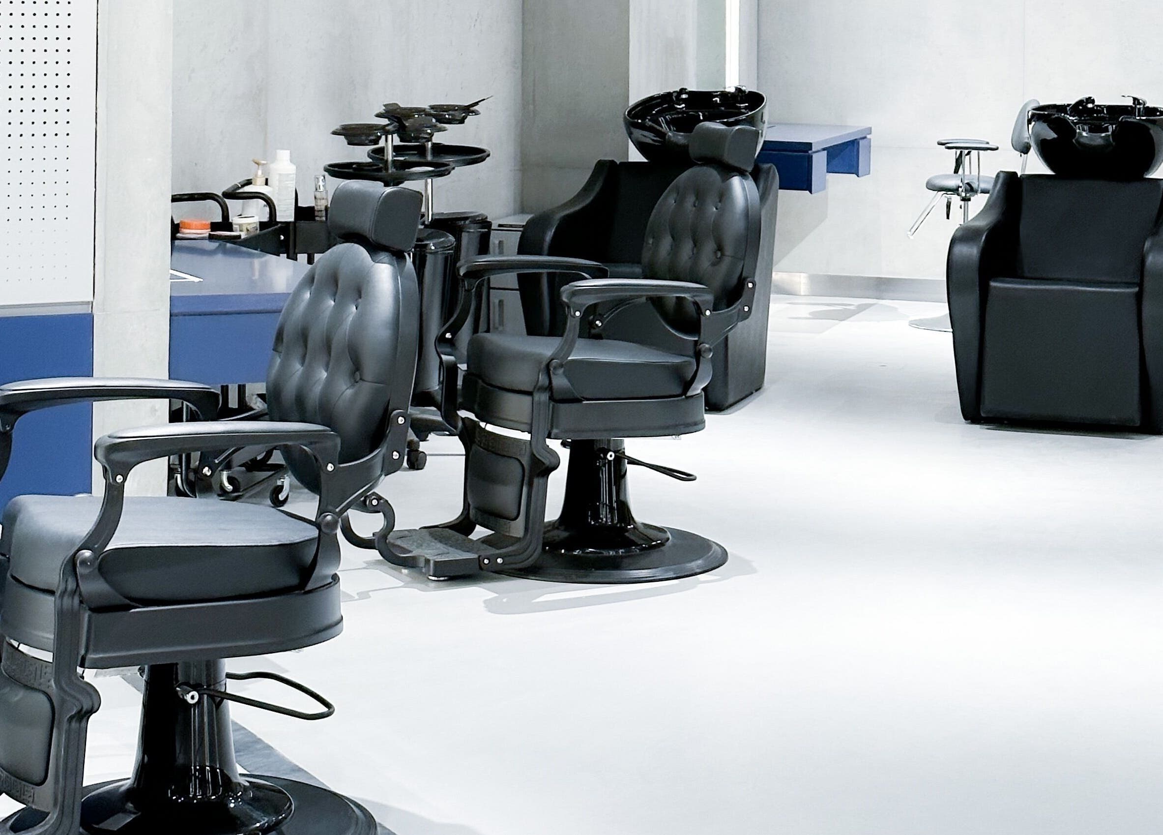 Modern styling chairs at 9CUTS Barber Shop, Riyadh I الرياض, SA enhance client comfort.
