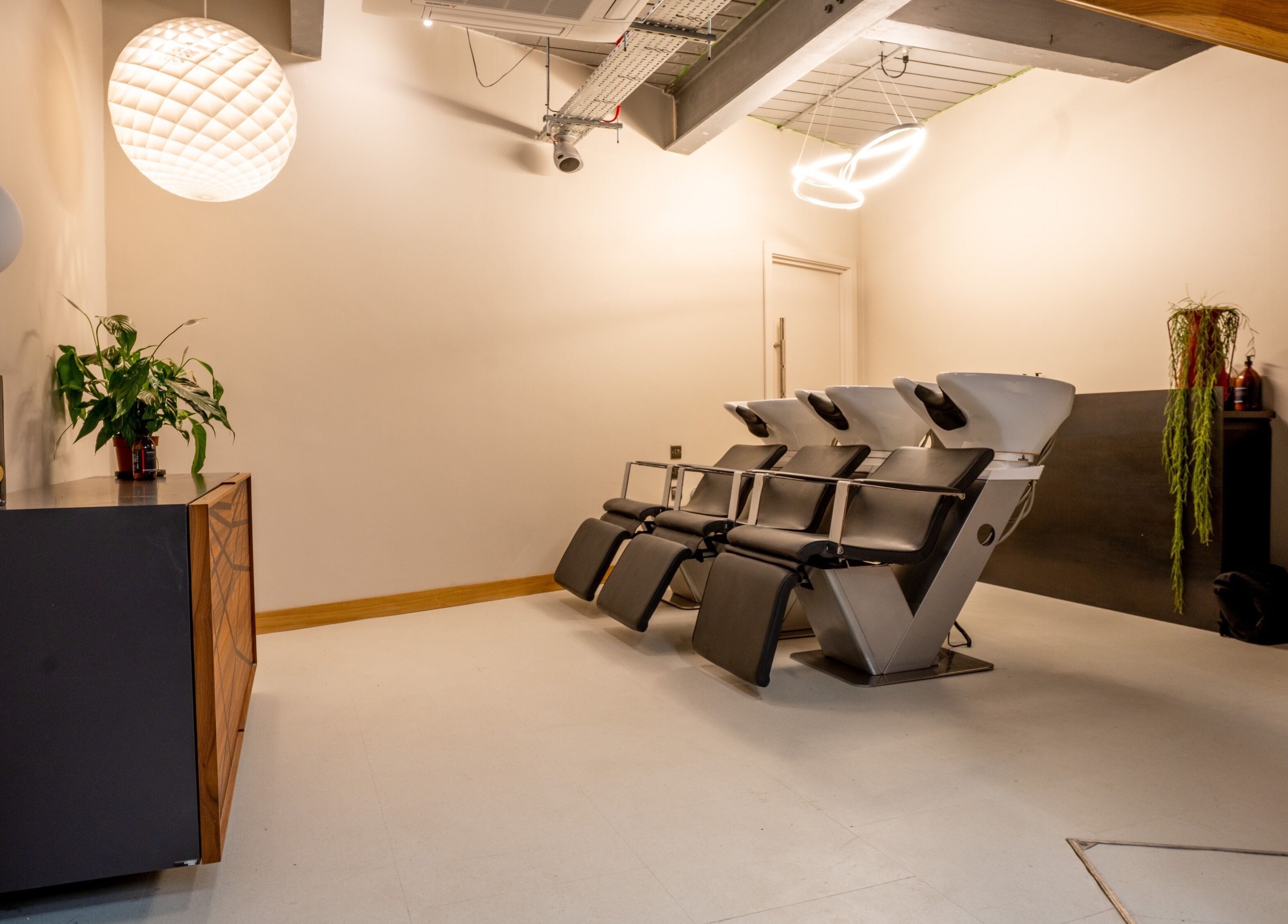 Elegant wash stations at Gareth Vance Salon in Leeds, England, GB, showcasing modern design and comfort.