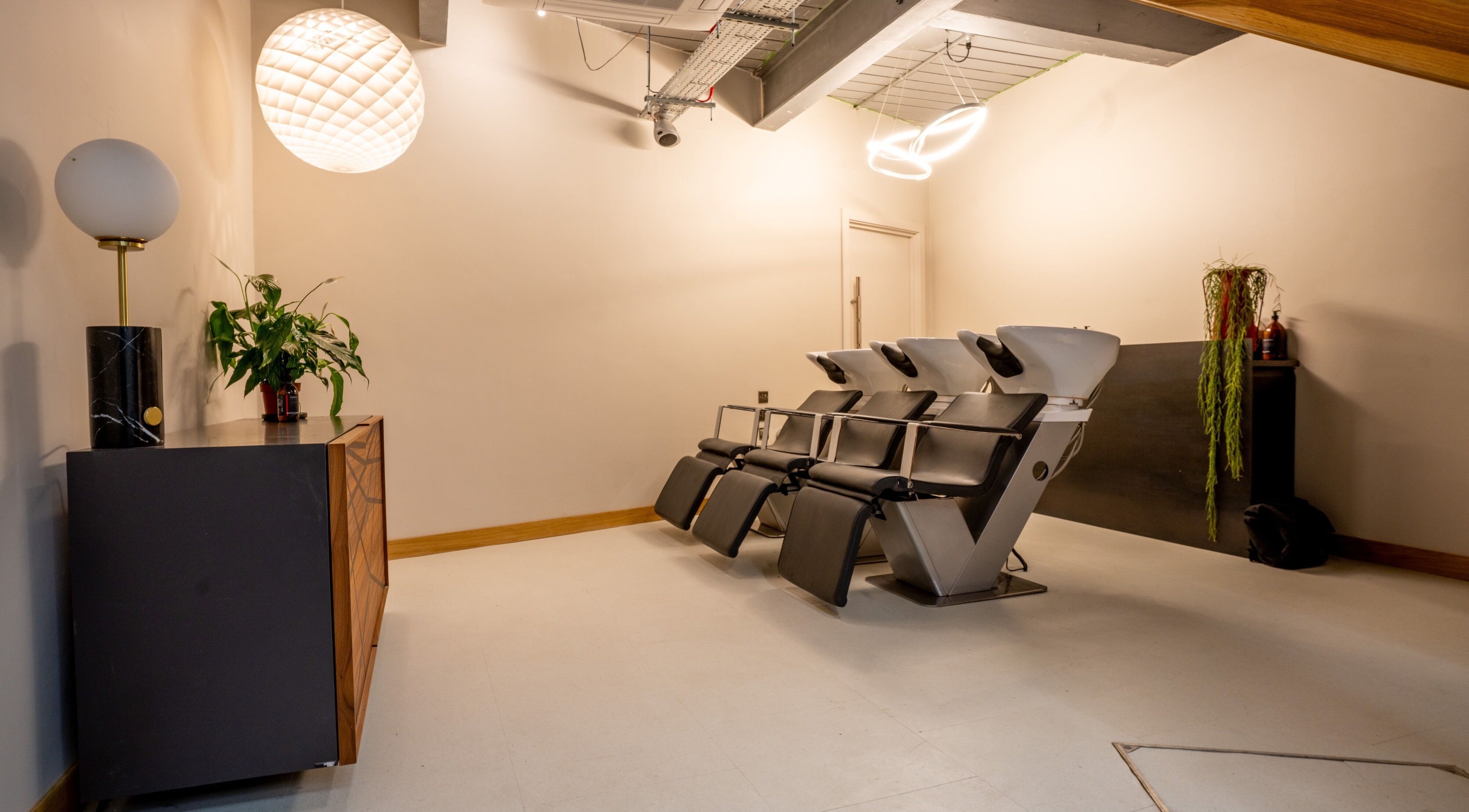 Elegant wash stations at Gareth Vance Salon in Leeds, England, GB, showcasing modern design and comfort.