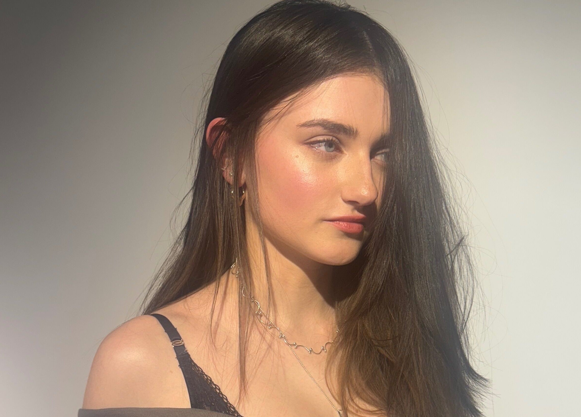 Model with flawless skin and sleek hair at Gareth Vance Salon, Leeds, England, GB.