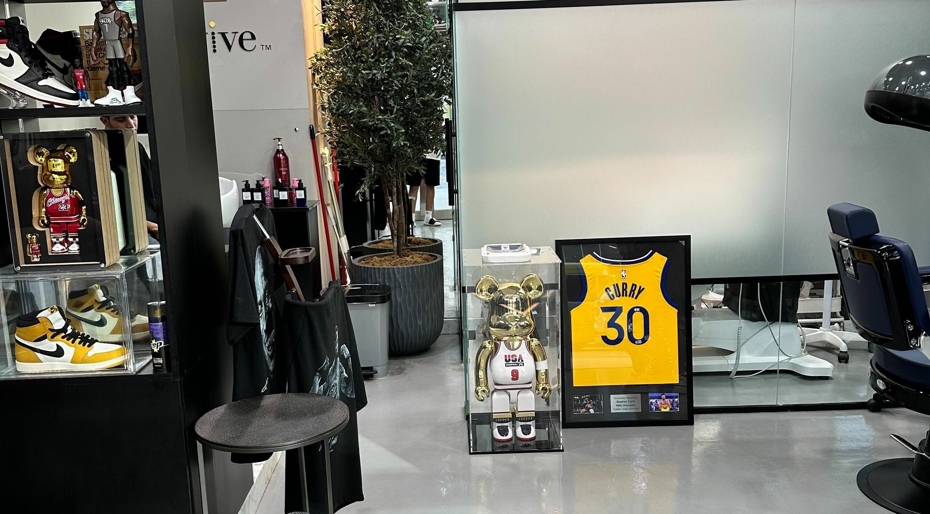 Stylish interior with collectibles at The Gents Salon, Dubai, Dubai, AE, showcasing unique decor.