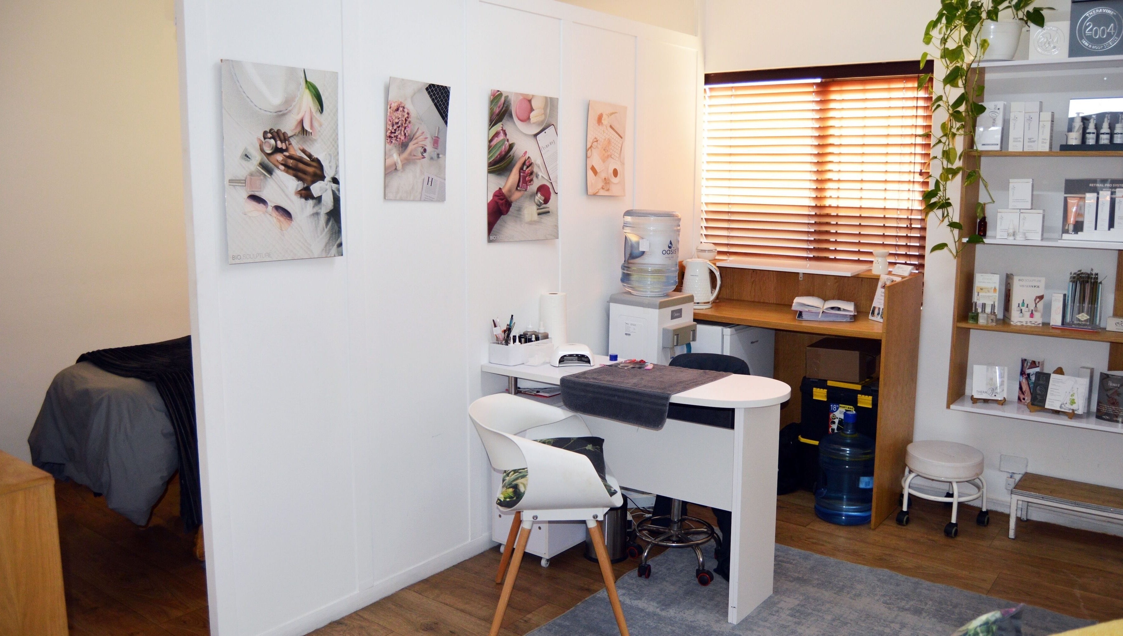 Chic interior of Lindsay Jordaan Beauty Boutique, Cape Town, Western Cape, ZA. Elegant decor and beauty products displayed.