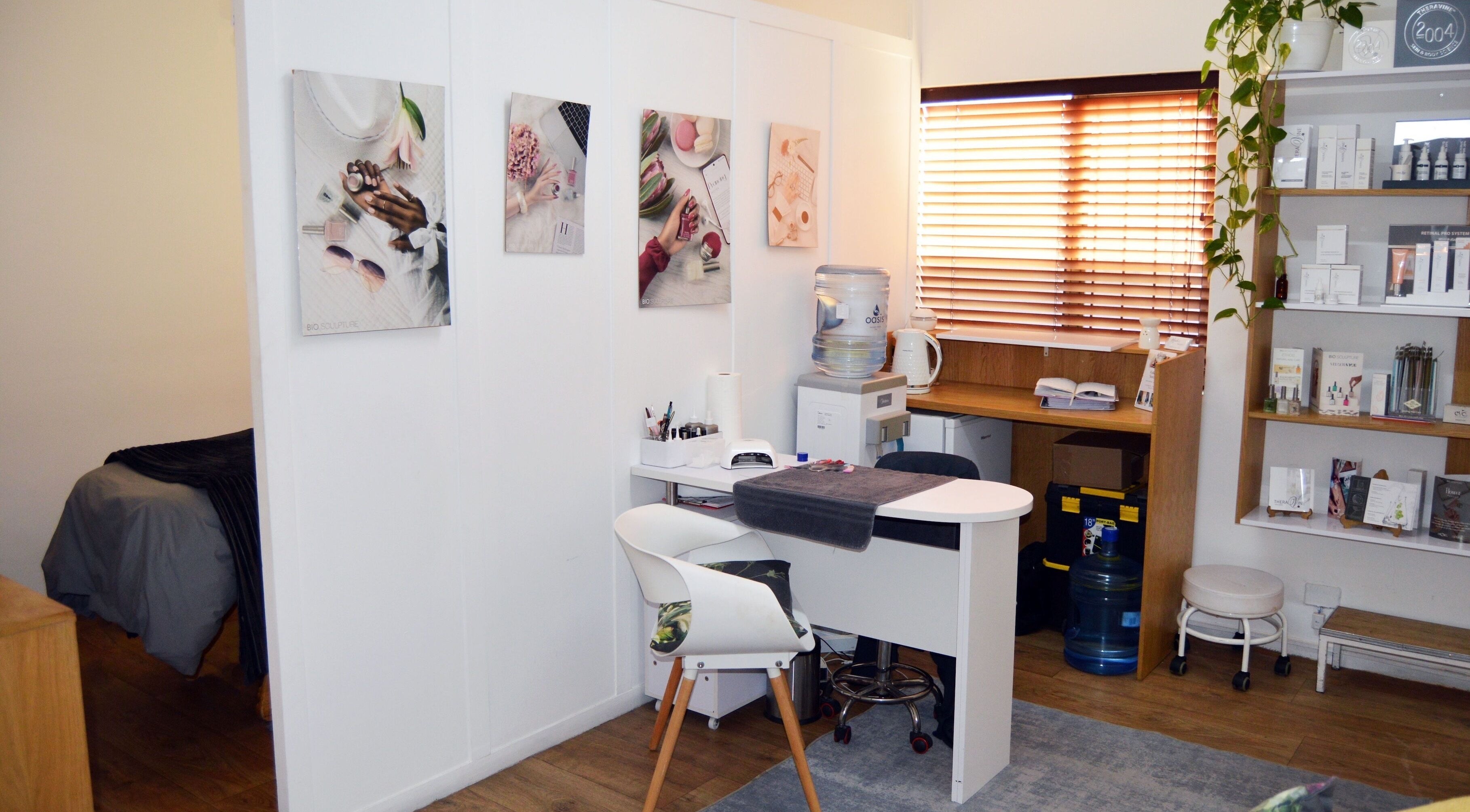 Chic interior of Lindsay Jordaan Beauty Boutique, Cape Town, Western Cape, ZA. Elegant decor and beauty products displayed.