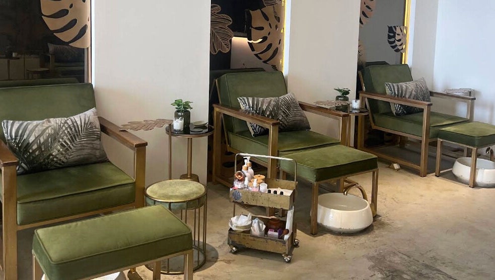 Relaxing green seating at Oaks, Riyadh, Riyadh Province, SA, ideal for beauty and wellness treatments.