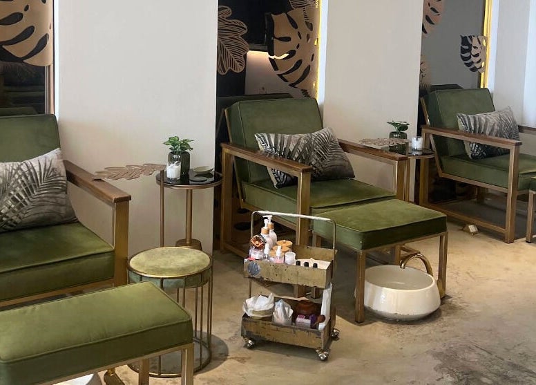 Relaxing green seating at Oaks, Riyadh, Riyadh Province, SA, ideal for beauty and wellness treatments.