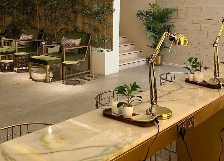 Elegant beauty lounge at Oaks, Riyadh, Riyadh Province, SA featuring plush seating and ambient decor.