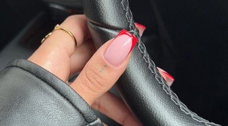 Stylish red-tipped nails at By Tiegan Natasha in Telford, England, GB; elegant nail art.