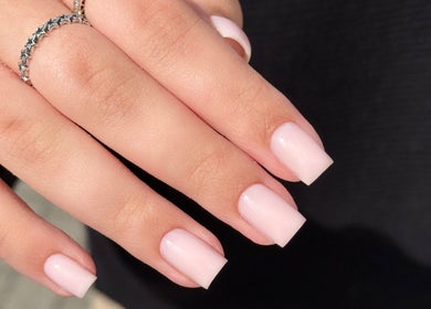 Manicured nails with pale pink polish at By Tiegan Natasha, Telford, England, GB.