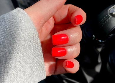 Bright red manicured nails by By Tiegan Natasha, Telford, England, GB shining in natural light.