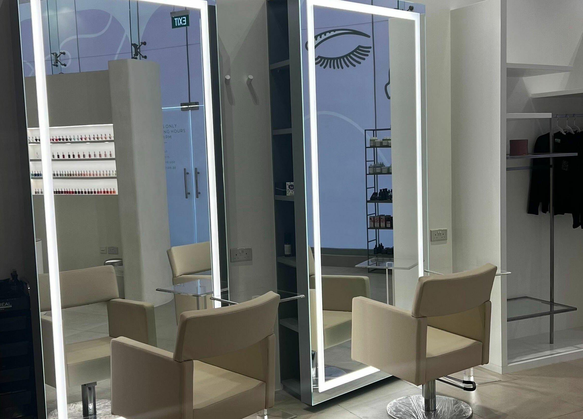 Modern salon space with mirrors and chairs at Mauve Spa, Abu Dhabi, AE, showcasing luxury and style.