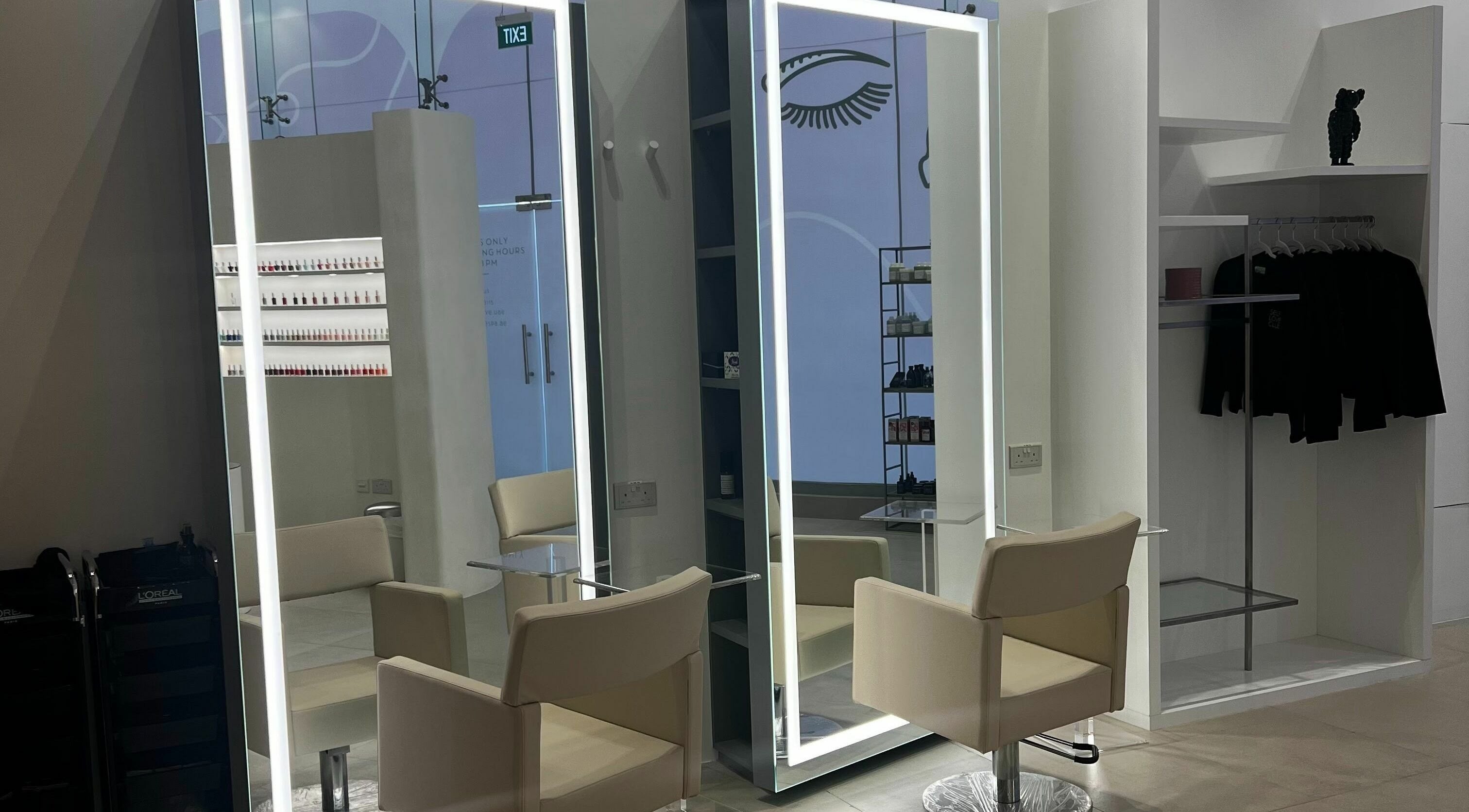 Modern salon space with mirrors and chairs at Mauve Spa, Abu Dhabi, AE, showcasing luxury and style.