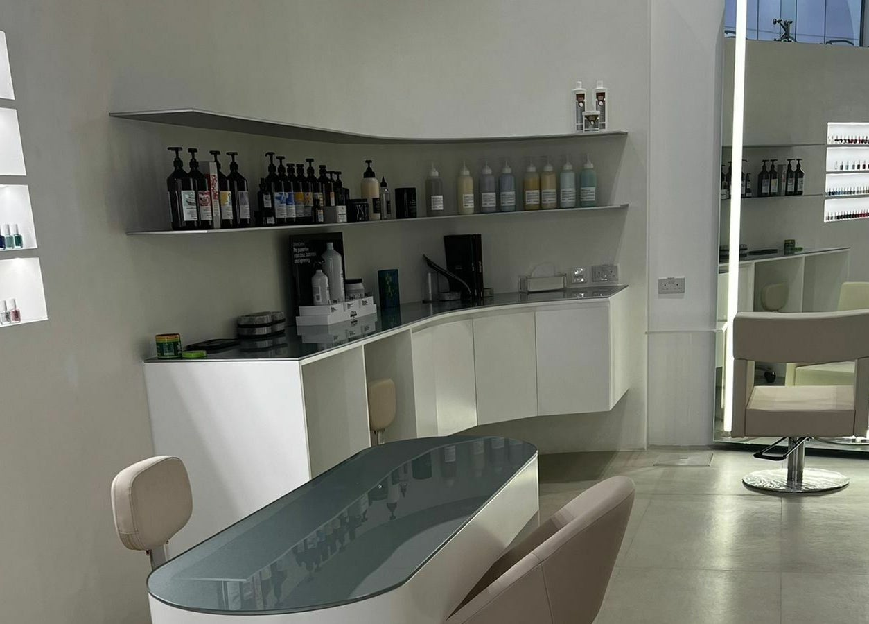 Modern nail station at Mauve Spa, Abu Dhabi, AE showcasing sleek design and extensive polish collection.