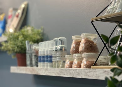 Lash Brow Edmonton, Alberta, CA cozy shelf with beauty products and plants.