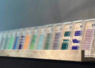 Array of colorful eyelash extensions at Lash Brow, Edmonton, Alberta, CA, neatly displayed on a shelf.