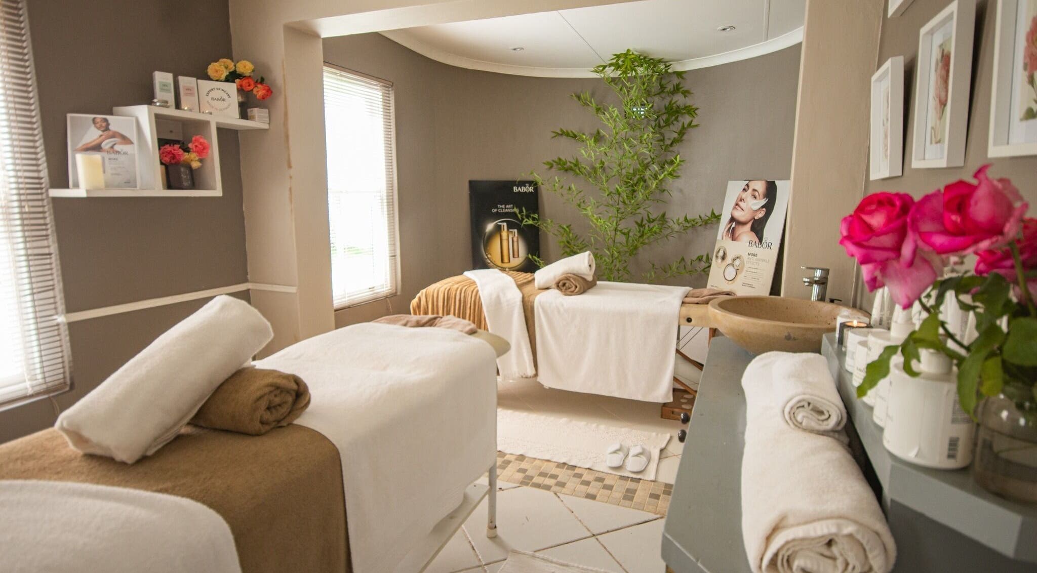 Relaxing massage room at The Kurland Spa, Plettenberg Bay, Western Cape, ZA adorned with flowers.