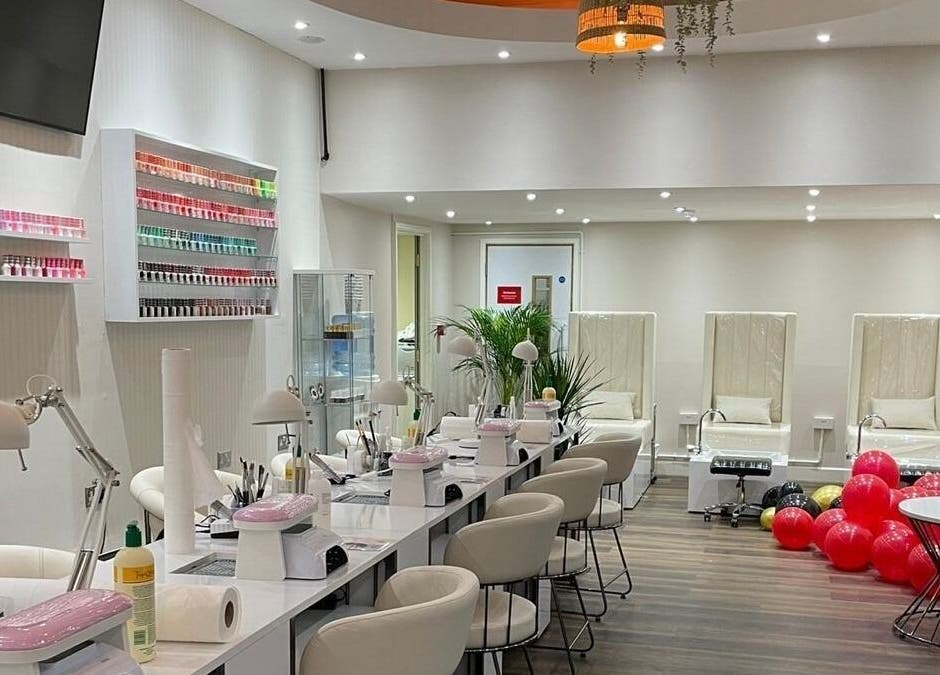Elegant interior of Buddha Nail Studio, Brighton, England, GB, featuring nail stations and pedicure chairs.