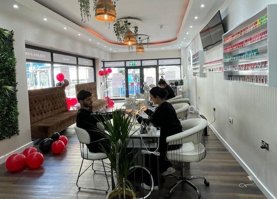 Guests enjoying nail services at Buddha Nail Studio in Brighton, England, GB, surrounded by chic decor.