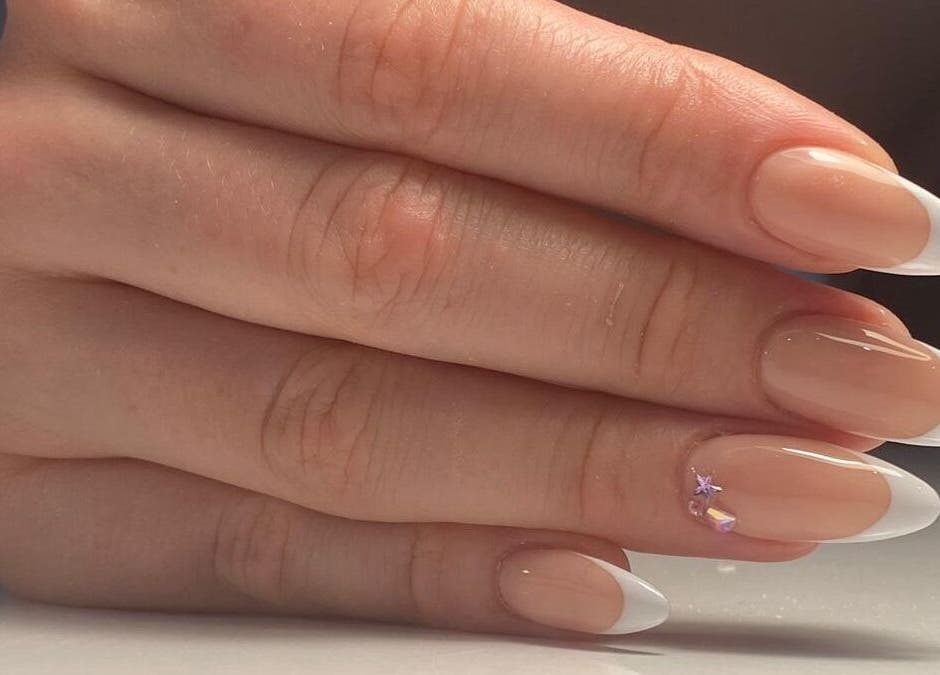Elegant French manicure at Buddha Nail Studio, Brighton, England, GB. Perfect for style and care.