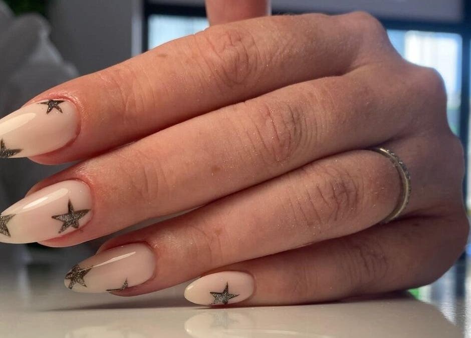 Stylish star nail design at Buddha Nail Studio, Brighton, England, GB, showcasing chic and modern art.