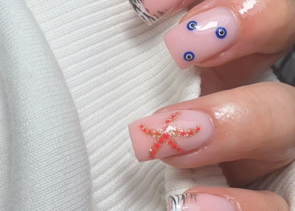 Elegant starfish nail art design at Bymolh in Lichfield, England, GB showcasing ocean-themed creativity.