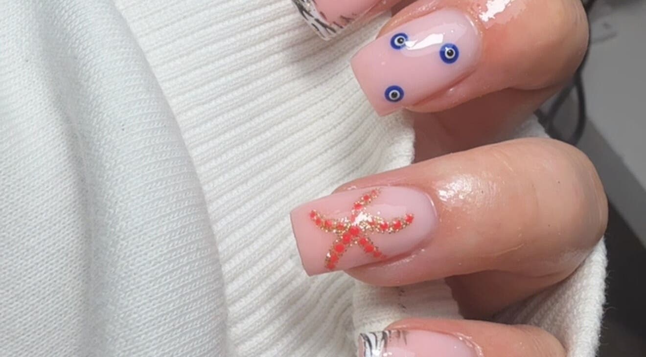 Elegant starfish nail art design at Bymolh in Lichfield, England, GB showcasing ocean-themed creativity.