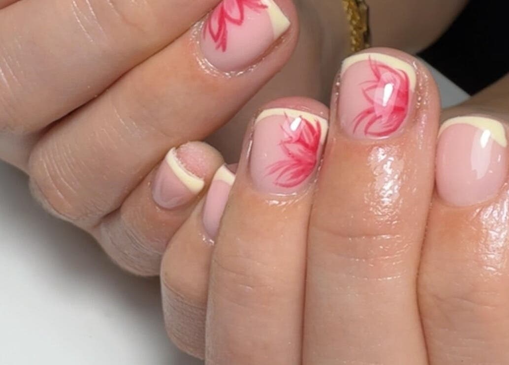 Elegant nail art with pink floral design at Bymolh, Lichfield, England, GB highlighting beauty services.