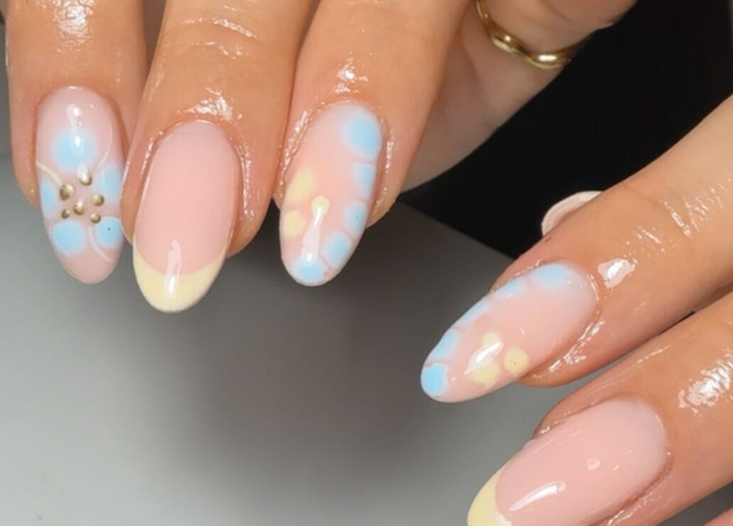 Chic pastel nail art with floral accents by Bymolh in Lichfield, England, GB, perfect for a stylish look.