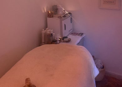 Relaxing treatment room at Jo Marie Holistic Beauty, Torquay, England, GB with a cozy massage table.
