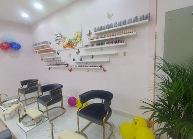 Toplist Nail Beauty Salon's chic pedicure area with seating and decor, Dubai, Dubai, AE.