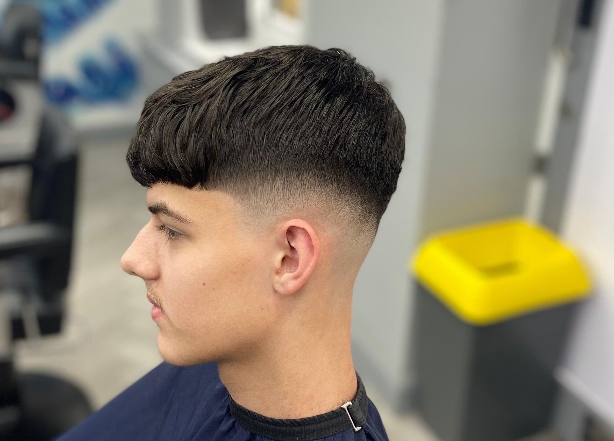 Side view of a gentleman with a fresh fade at Barber Crew Wokingham, Wokingham, England, GB.