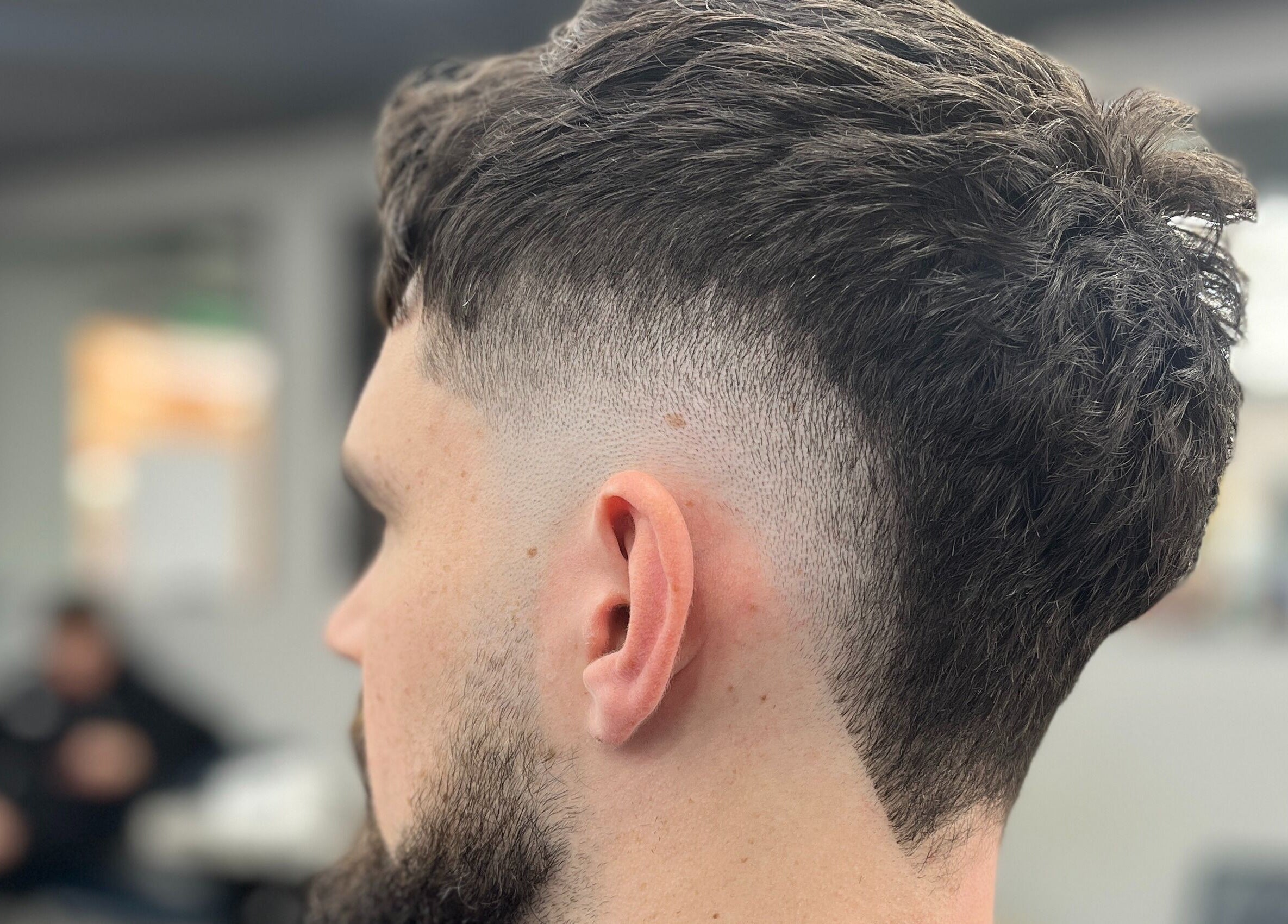 Close-up of a stylish fade haircut at Barber Crew Wokingham, Wokingham, England, GB.