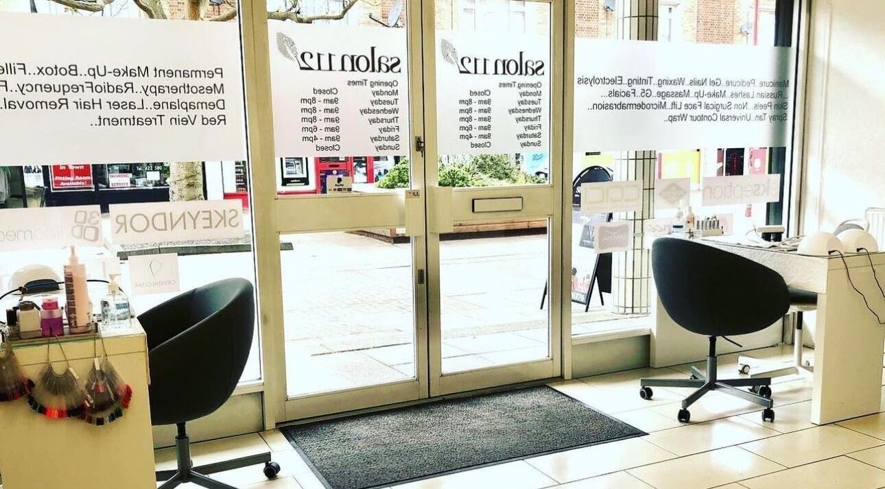 Inviting interior of Salon 112, Harlow, England, GB, showcasing chic seating and beauty product displays.