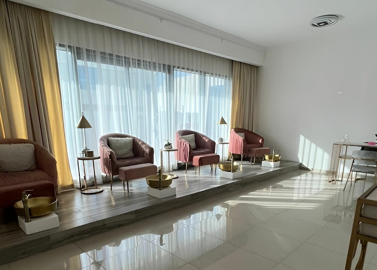 Interior of Hair and Nail Saloon Ajman featuring plush chairs and golden accents, located in عجمان, عجمان, AE.