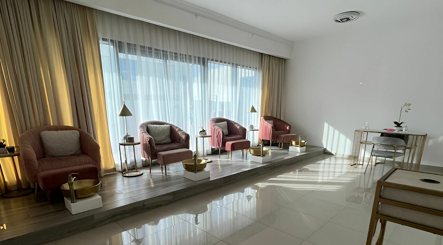 Interior of Hair and Nail Saloon Ajman featuring plush chairs and golden accents, located in عجمان, عجمان, AE.