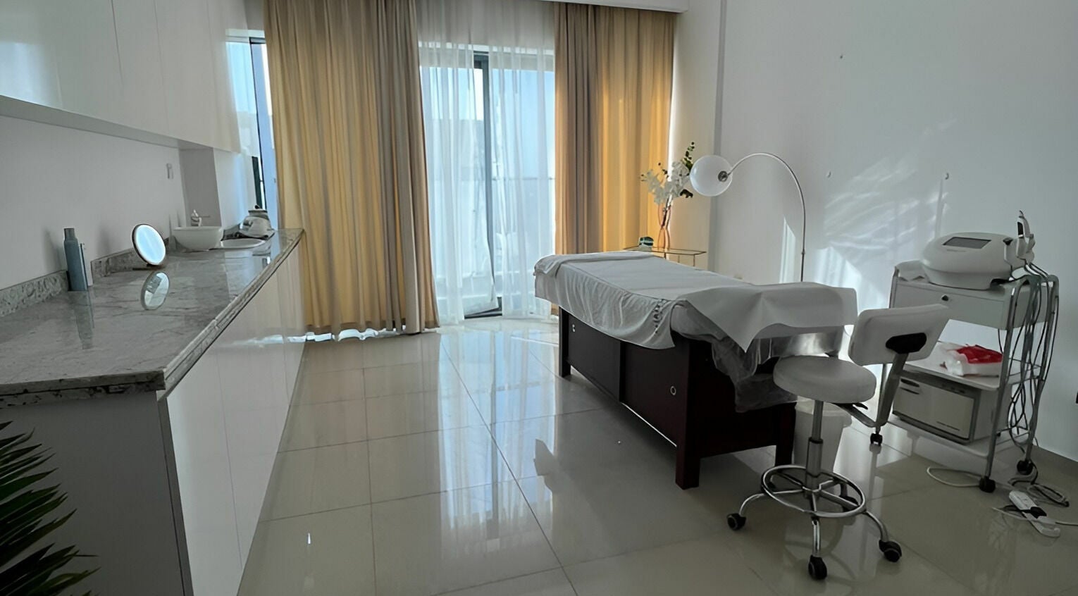 Luxurious spa room at Hair and Nail Saloon Ajman, عجمان, عجمان, AE, with massage bed and natural light.