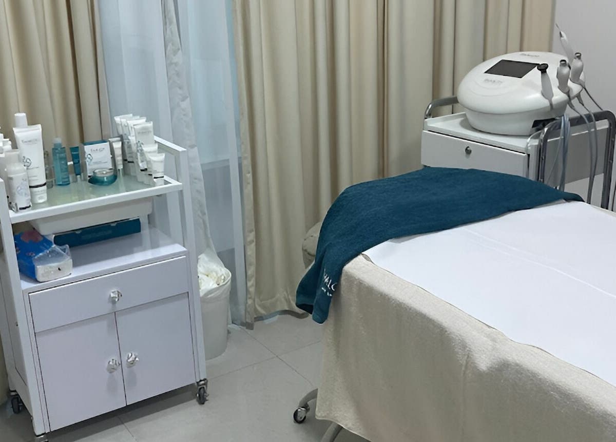 A tranquil treatment room at Hair and Nail Saloon Ajman, عجمان, عجمان, AE featuring a massage table and skincare products.