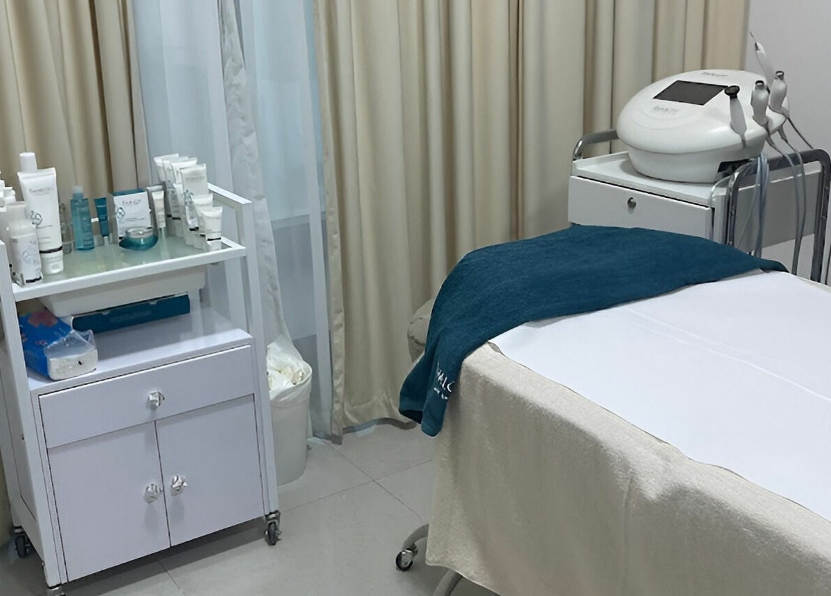 A tranquil treatment room at Hair and Nail Saloon Ajman, عجمان, عجمان, AE featuring a massage table and skincare products.