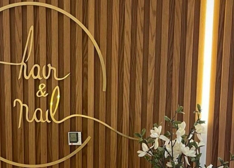 Stylish wooden decor at Hair and Nail Saloon Ajman, عجمان, عجمان, AE with floral accents.
