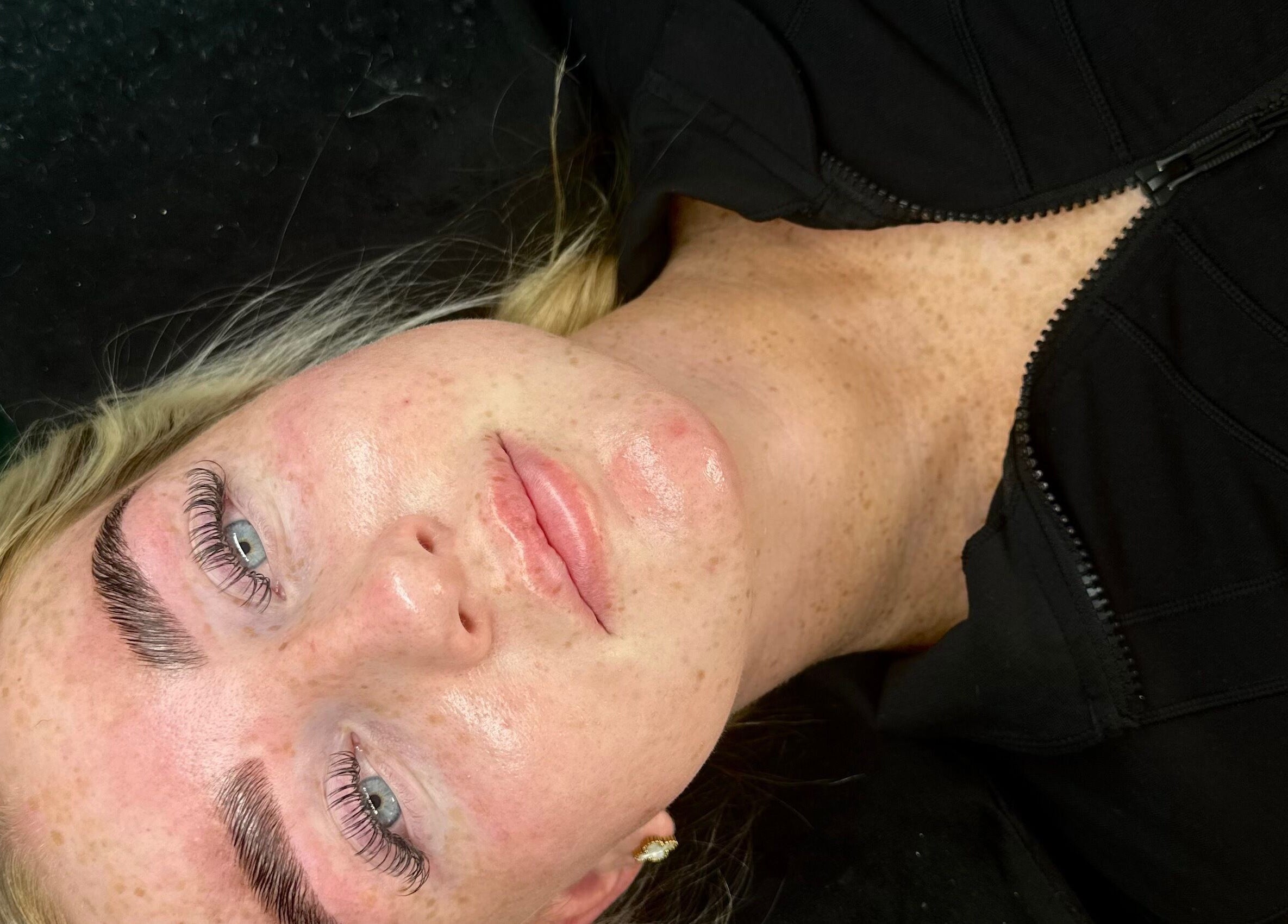 Client with enhanced lashes at Ladore Lashes in Scholes, England, GB, showcasing expert beauty treatment.