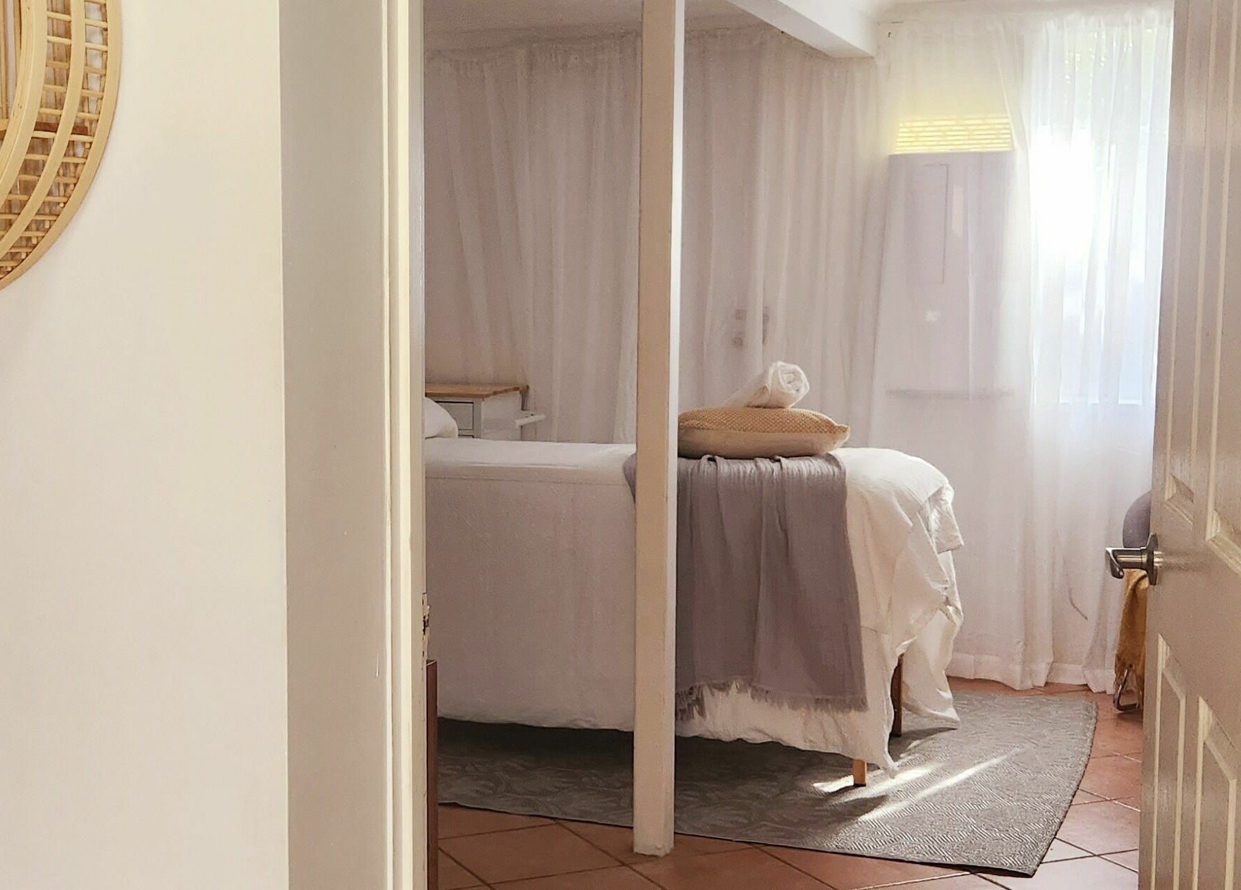 Cozy spa room at Authentic Zen Beauty, New Auckland, Queensland, AU with bed and soft lighting.