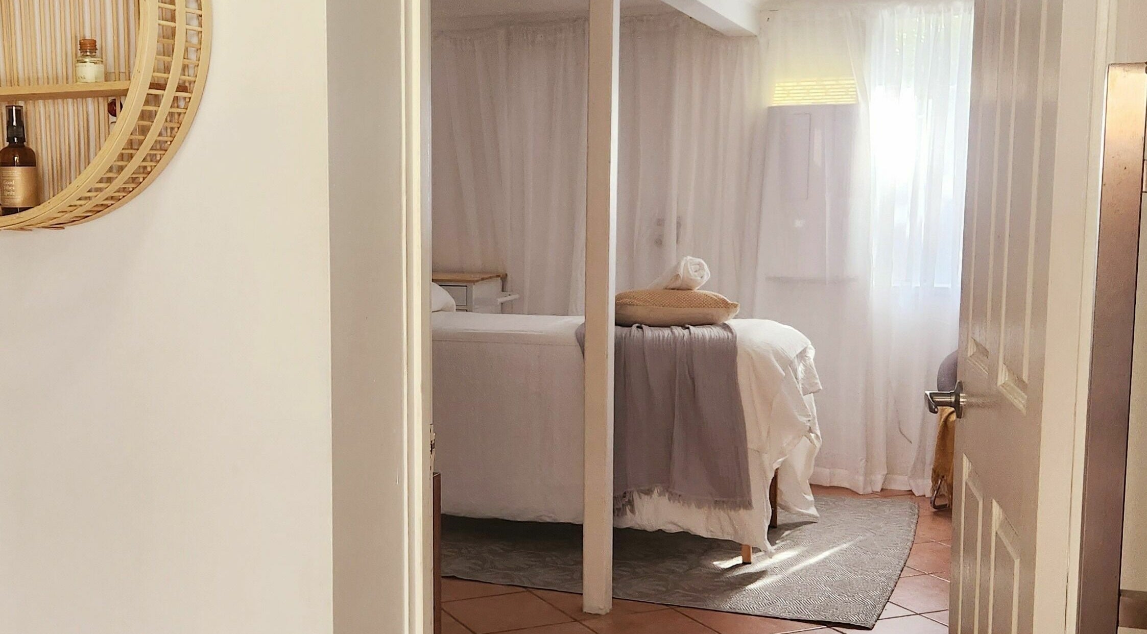 Cozy spa room at Authentic Zen Beauty, New Auckland, Queensland, AU with bed and soft lighting.