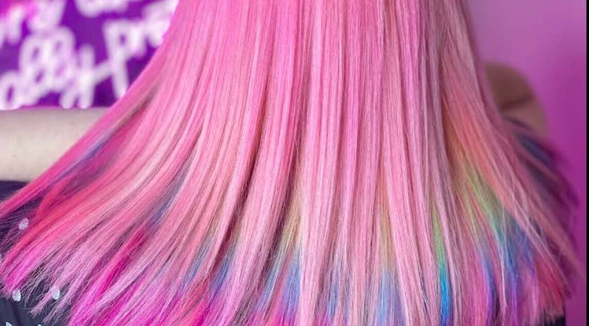 Colorful pastel hair with pink strands at Empress Hair, Hull, England, GB showcasing artistic styling.