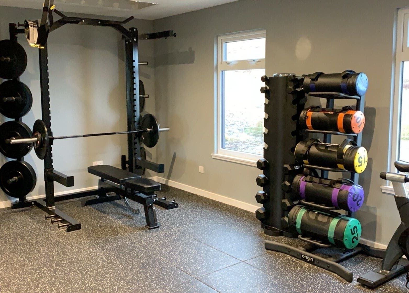 Modern gym at KB Fitness, Scotland, Scotland, GB featuring weightlifting equipment and vibrant weights.