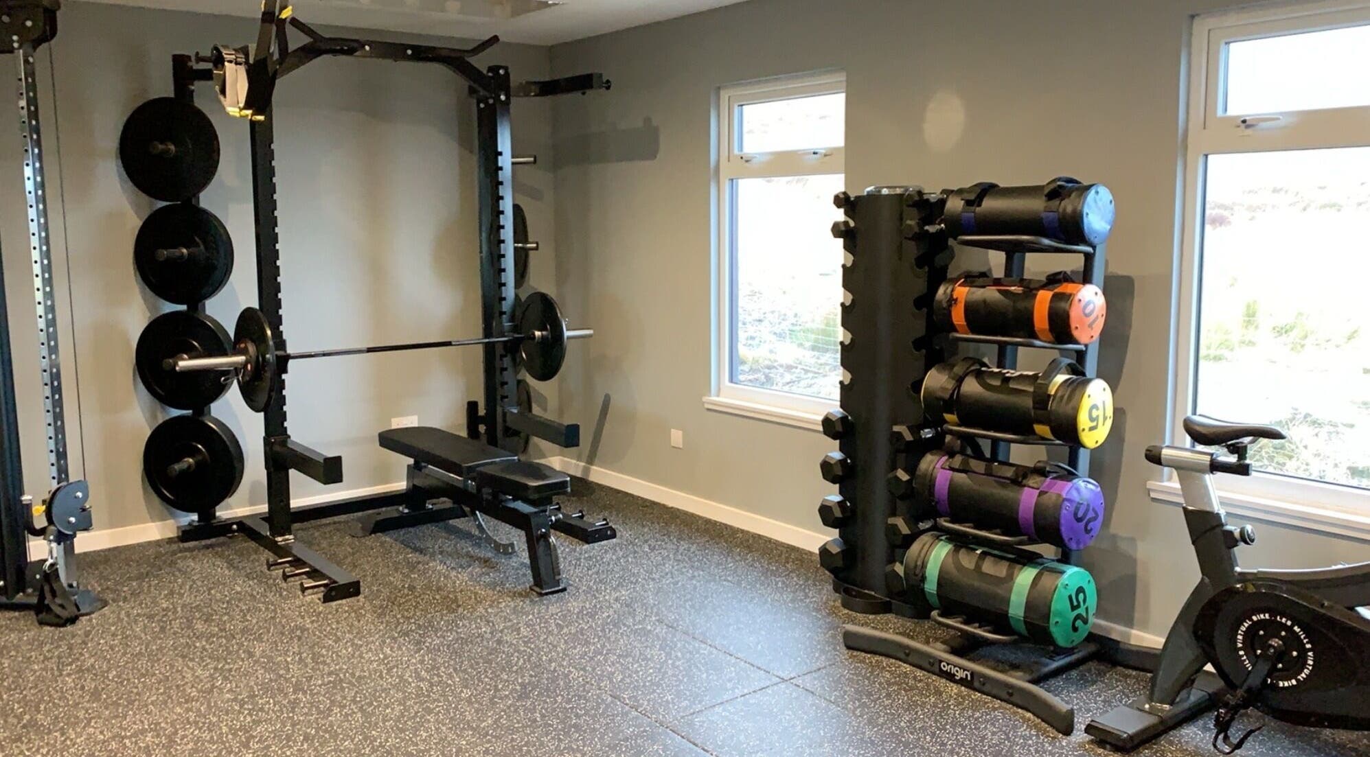 Modern gym at KB Fitness, Scotland, Scotland, GB featuring weightlifting equipment and vibrant weights.