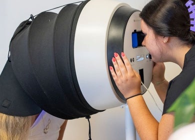 Aesthetician performs skin analysis at Armor Beauty in Knoxville, Tennessee, US using advanced technology.