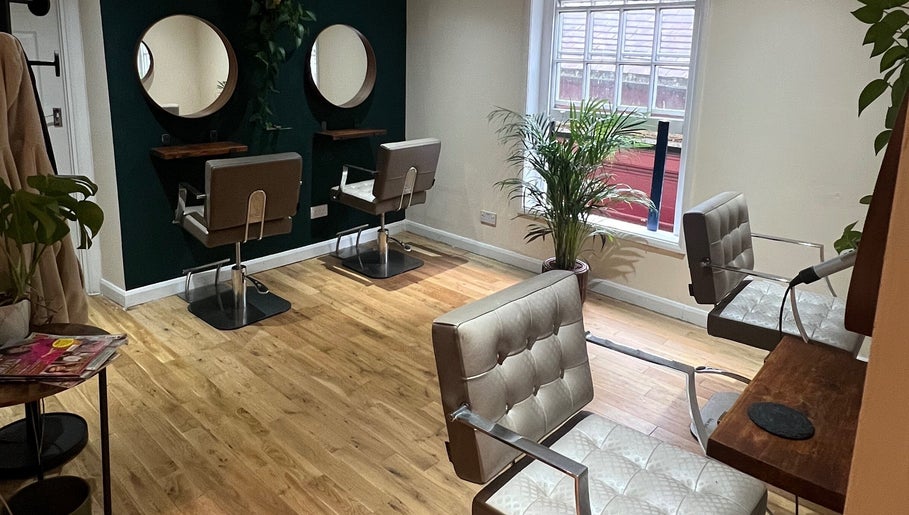 Cozy, modern salon chairs and mirrors at Natural Hair Studio, Horsham, England, GB.